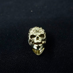 cord end skull in gold metal